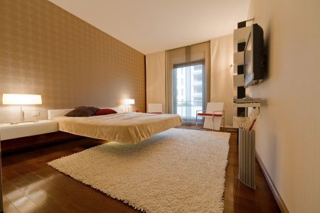 Dormitor cu pat în consolă Apartament în Băneasa